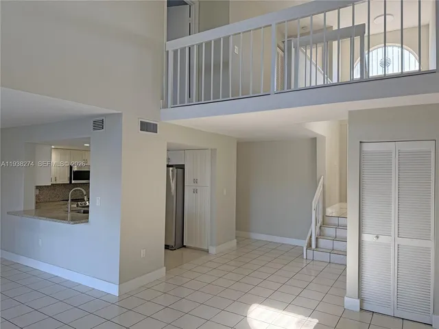 an empty room with wooden floor