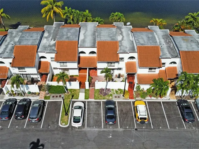 an aerial view of residential houses with street