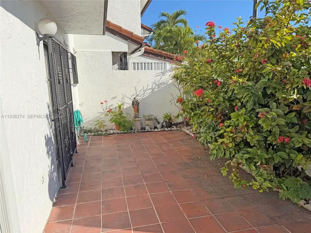 a view of a pathway both side of a house
