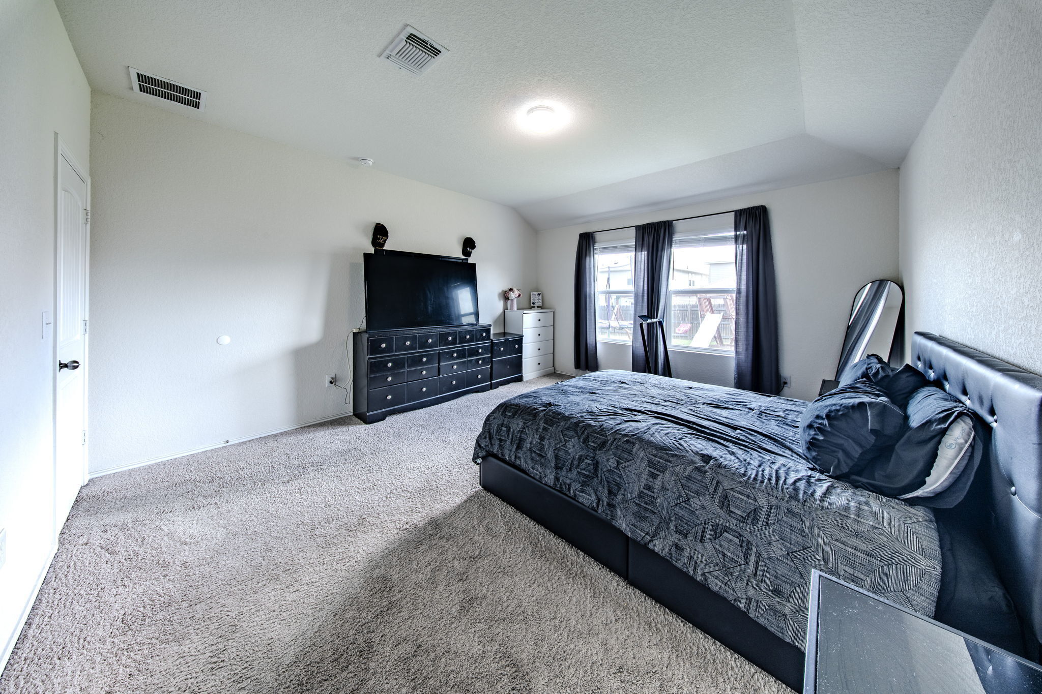 14903 Tuff Road Manor, TX 78653 - Photo 9 of 25 A generously sized sleeping area offers ample space and plush carpeting.