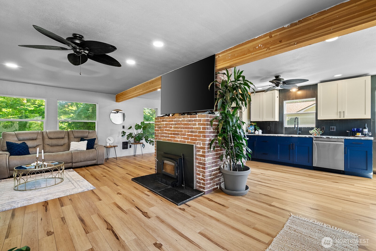 307 4th Street Steilacoom, WA 98388 - Photo 6 of 39 a living room with furniture a fireplace and a potted plant