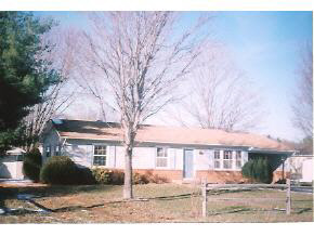 66 Buckboard Road Waynesboro, VA 22980 - Photo 1 of 1 a front view of building with a yard