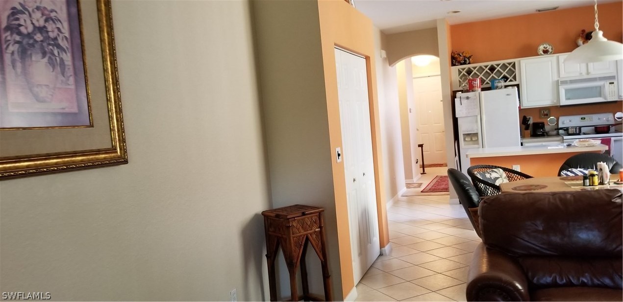 9341 Chestnut Tree Loop Fort Myers, FL 33967 - Photo 11 of 31 a dining room with furniture and a rug