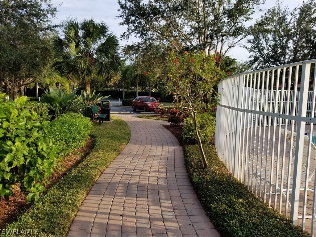 9341 Chestnut Tree Loop Fort Myers, FL 33967 - Photo 26 of 31 a view of a backyard with pathway