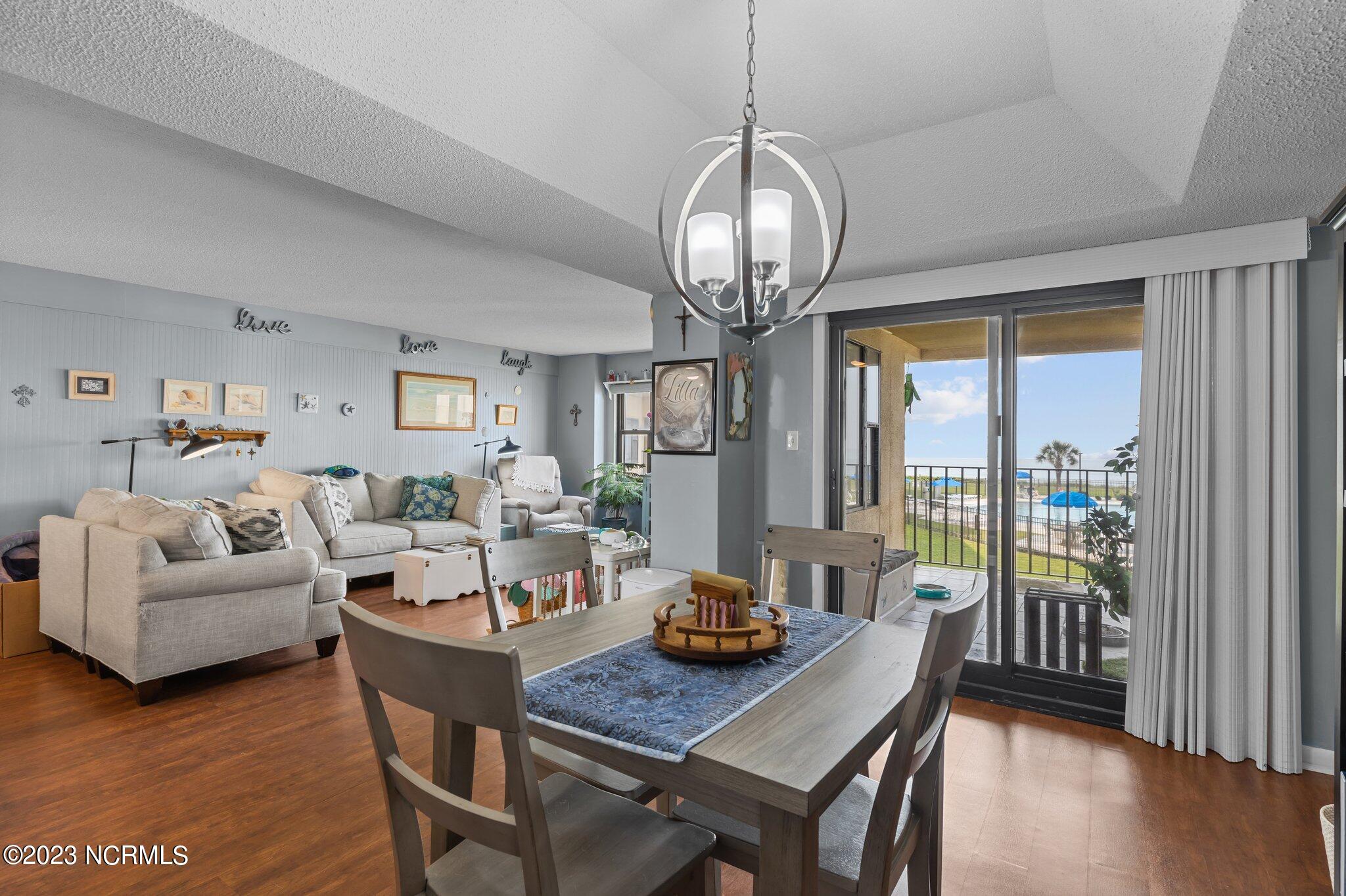1505 Salter Path Road, Unit 238 Indian Beach, NC 28512 - Photo 14 of 49 view from dining area across living room and out door to balcony