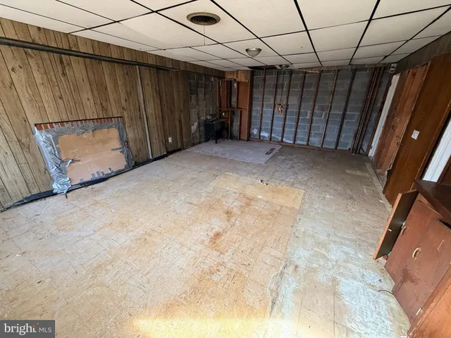 a view of a backyard with a bench in patio