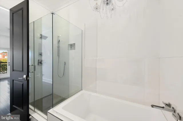 a bathroom with a bathtub and a shower