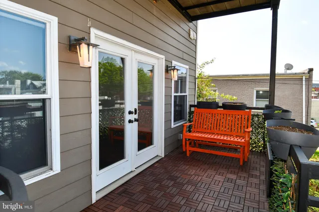 a blue bench sitting in front of a building