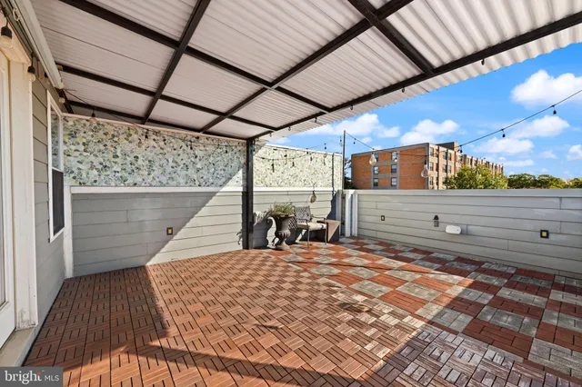 a view of a chairs and table in the patio