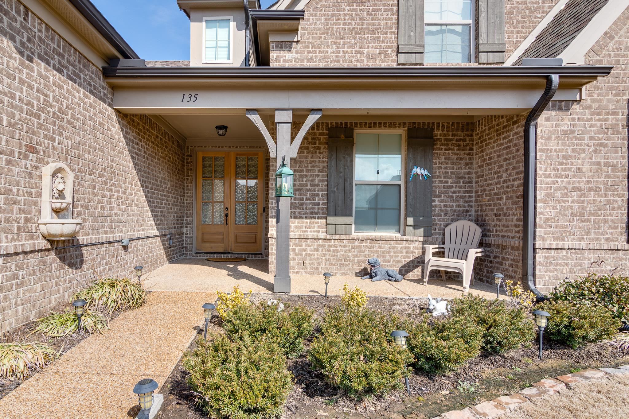 135 Chesnut Rdg Drive Oakland, TN 38060 - Photo 2 of 36 Entrance to property featuring covered porch and brick siding