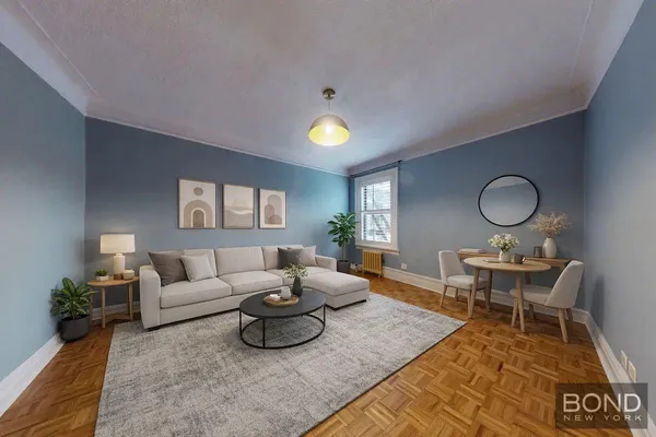 a living room with furniture and a lamp