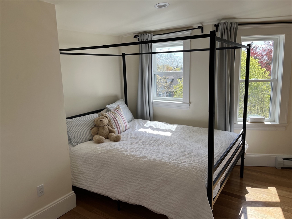 3 Chester Road, Unit 3 Belmont, MA 02478 - Photo 26 of 40 a bedroom with a bed window and mirror