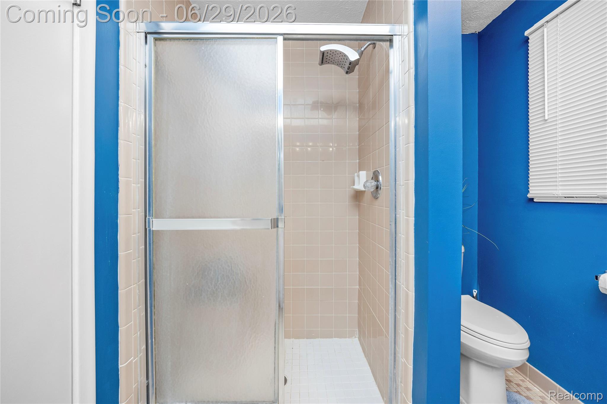 6085 Worlington Road Bloomfield Hills, MI 48301 - Photo 40 of 75 Shower enclosure with a chrome frame and frosted glass panels