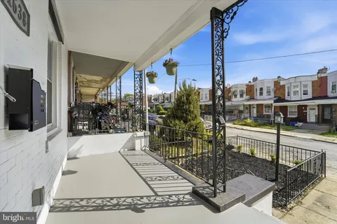 a view of a balcony with chairs
