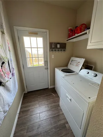 a view of utility room and bedroom