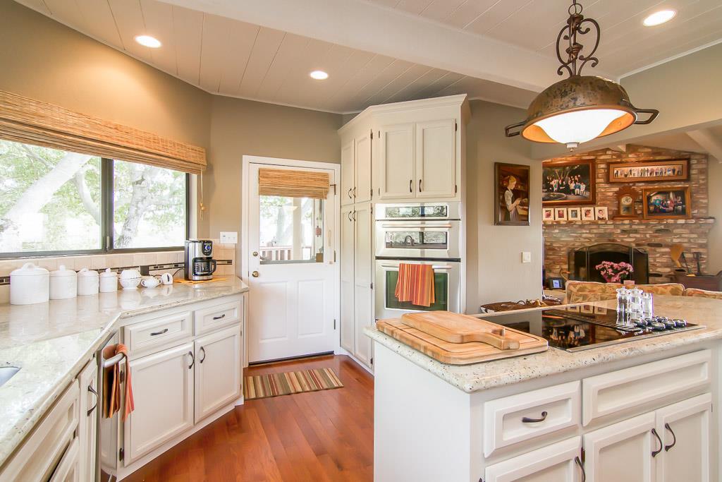 8900 Manfroy Ranch Road Gilroy, CA 95020 - Photo 3 of 12 a kitchen with a stove a sink a refrigerator and windows