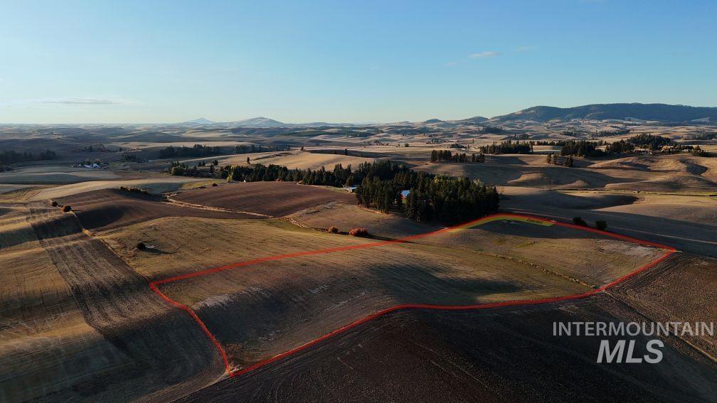 Tbd-lot 2 Boller Road Potlatch, ID 83855 - Photo 2 of 5 Overview of rural landscape with property boundaries highlighted and a mountainous background