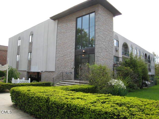 697 Cove Road, Unit 2H Stamford, CT 06902 - Photo 1 of 1 a house view with a outdoor space