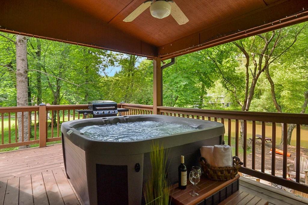 46 Floral Court Ellijay, GA 30540 - Photo 2 of 38 a view of a balcony with furniture and wooden floor