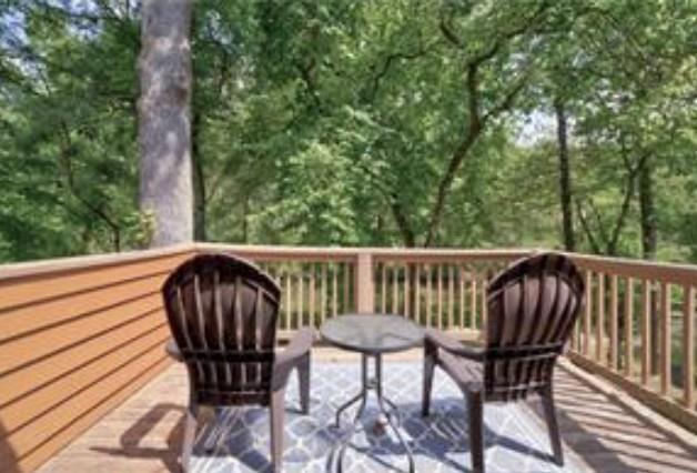 46 Floral Court Ellijay, GA 30540 - Photo 25 of 38 a view of a chair in wooden deck