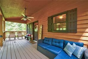46 Floral Court Ellijay, GA 30540 - Photo 26 of 38 a living room with furniture and a large window