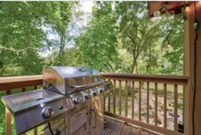 46 Floral Court Ellijay, GA 30540 - Photo 28 of 38 a view of a balcony with chairs