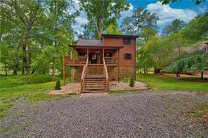 46 Floral Court Ellijay, GA 30540 - Photo 4 of 38 a view of a house with backyard
