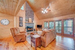 46 Floral Court Ellijay, GA 30540 - Photo 5 of 38 a living room with furniture and a fireplace