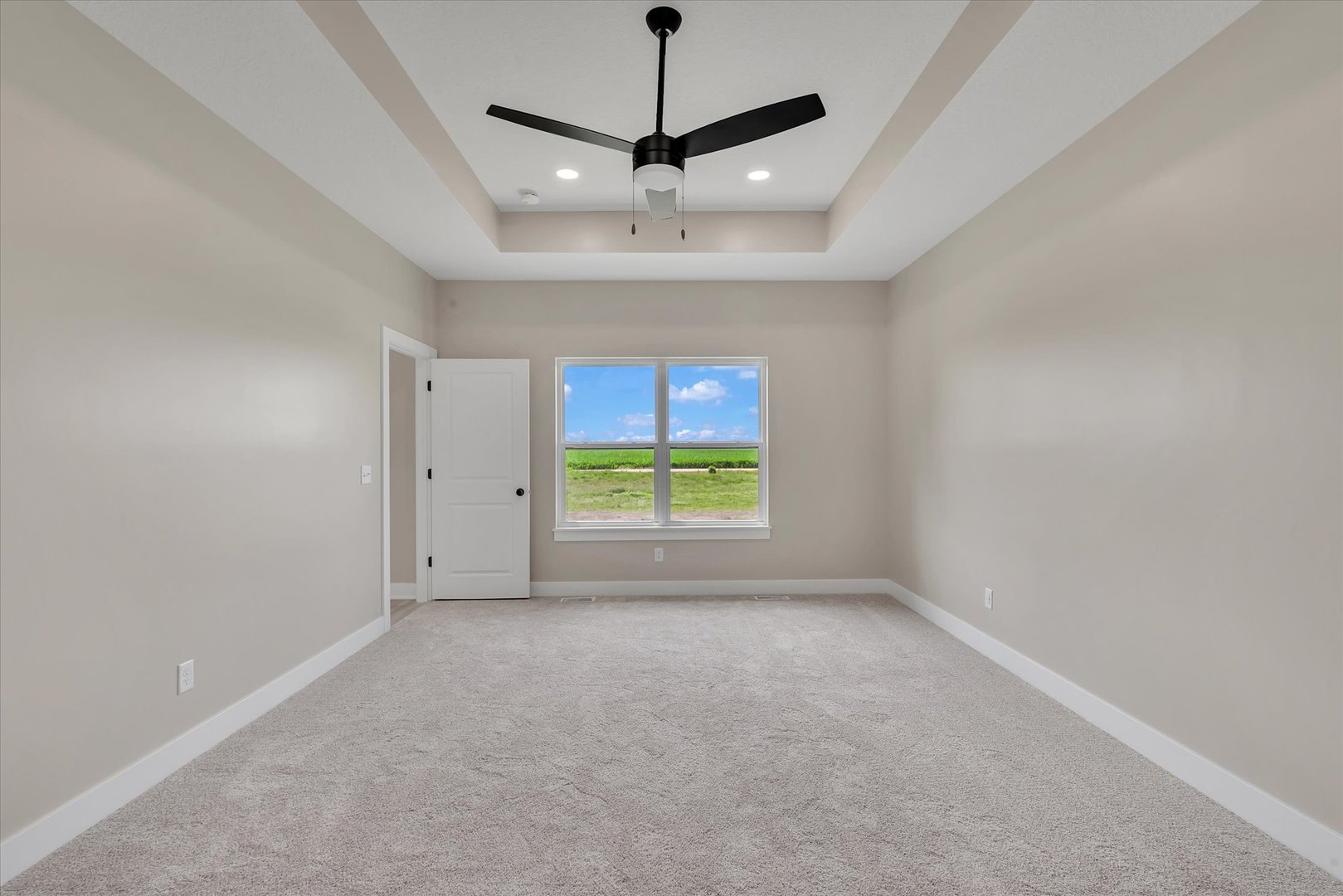 455 Rhonda Road New Liberty, IA 52765 - Photo 33 of 54 a view of room with window and a ceiling fan