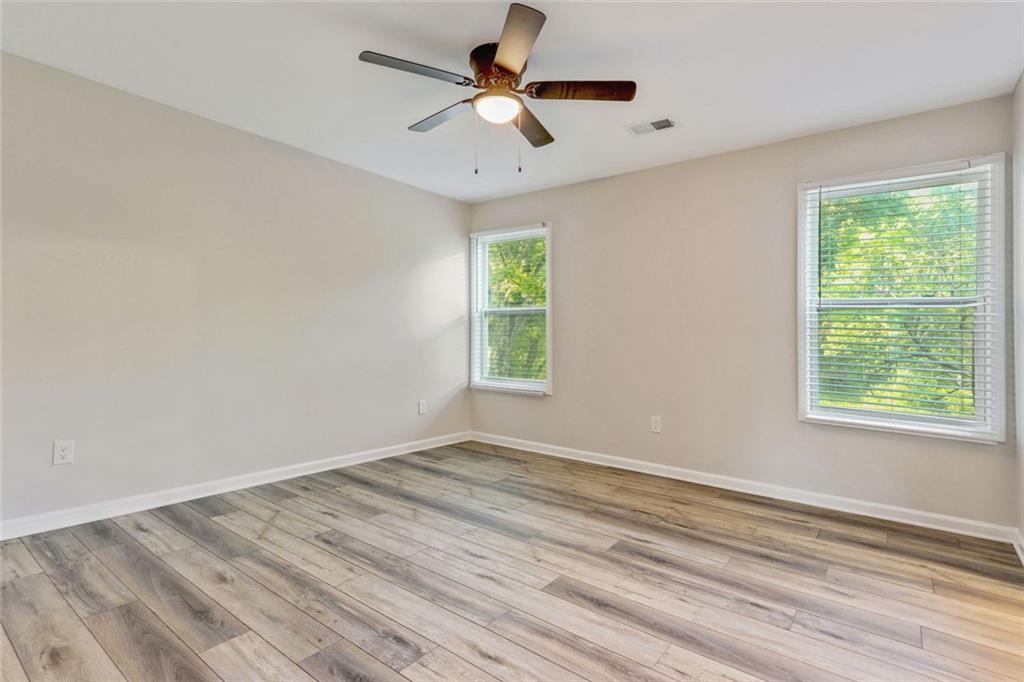 129 Pierce Hill Road Northeast Rome, GA 30161 - Photo 12 of 25 a view of empty room with window and ceiling fan