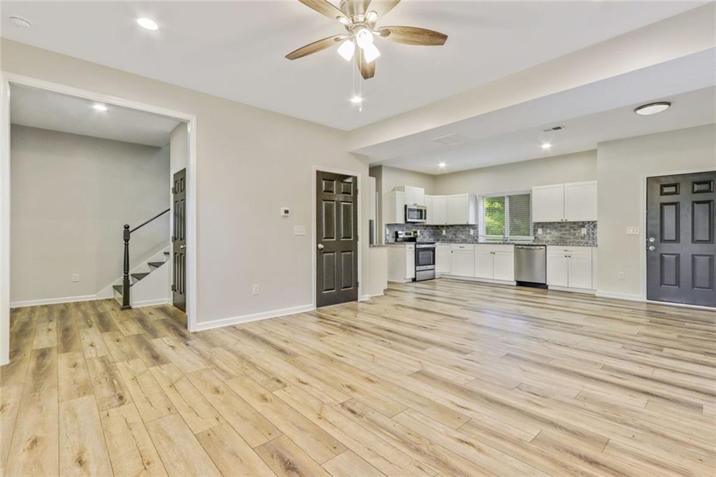 129 Pierce Hill Road Northeast Rome, GA 30161 - Photo 5 of 25 a view of a kitchen with a sink and cabinets