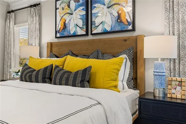 a bedroom with a bed and cupboard