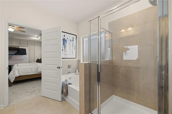 a bathroom with a glass shower door