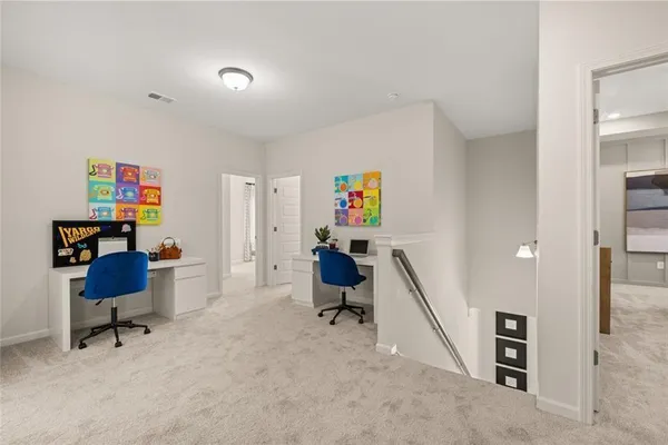 a bedroom with a bed and large windows