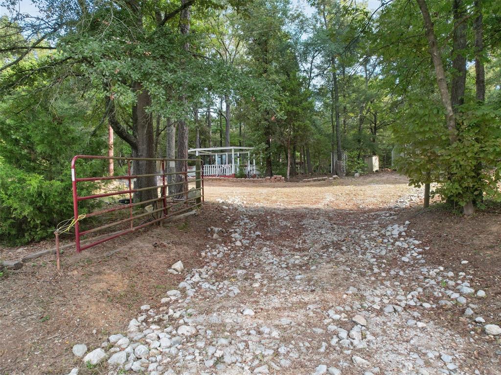 4608 Highway 154 Gilmer, TX 75644 - Photo 6 of 25 a view of outdoor space with deck and yard