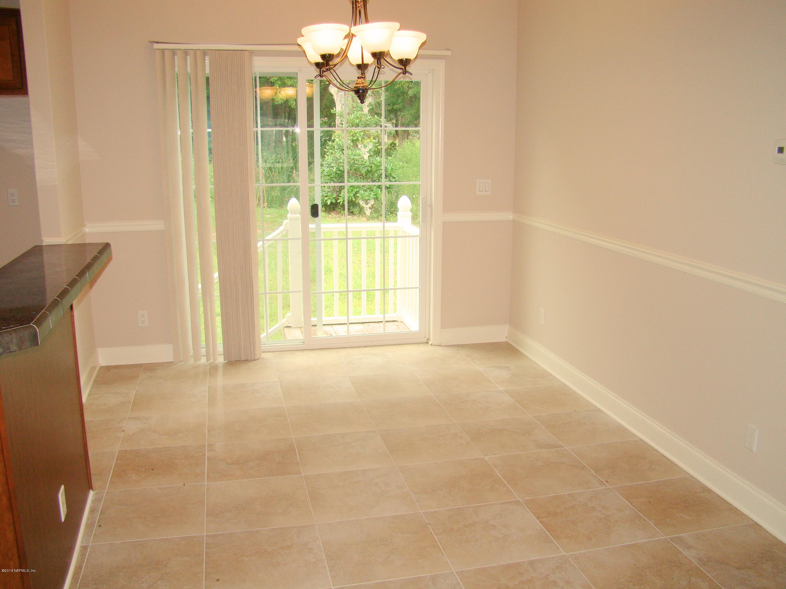 1716 Mccaul Road Jacksonville, FL 32220 - Photo 12 of 25 a view of an empty room with a window