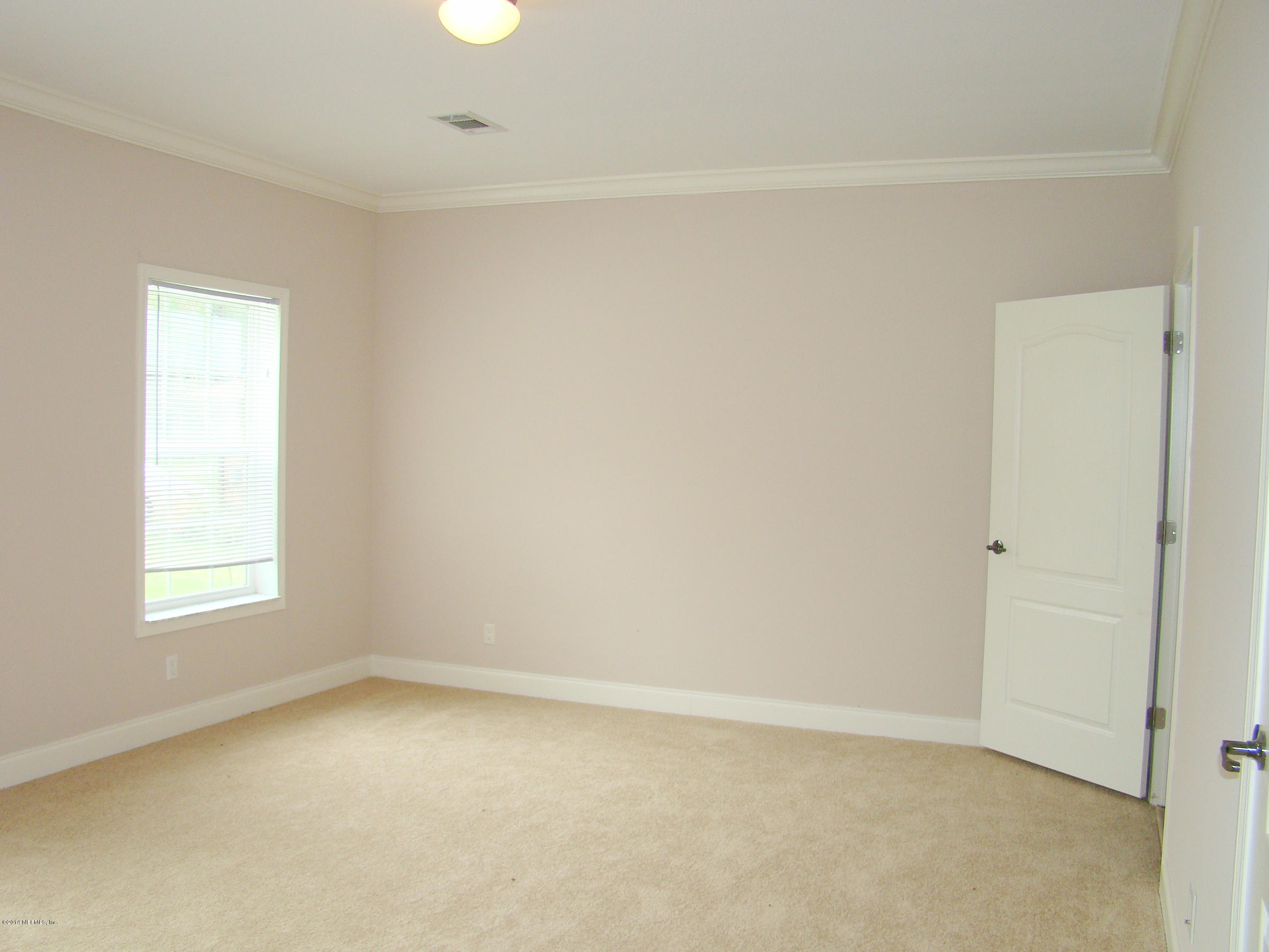 1716 Mccaul Road Jacksonville, FL 32220 - Photo 15 of 25 an empty room with a window