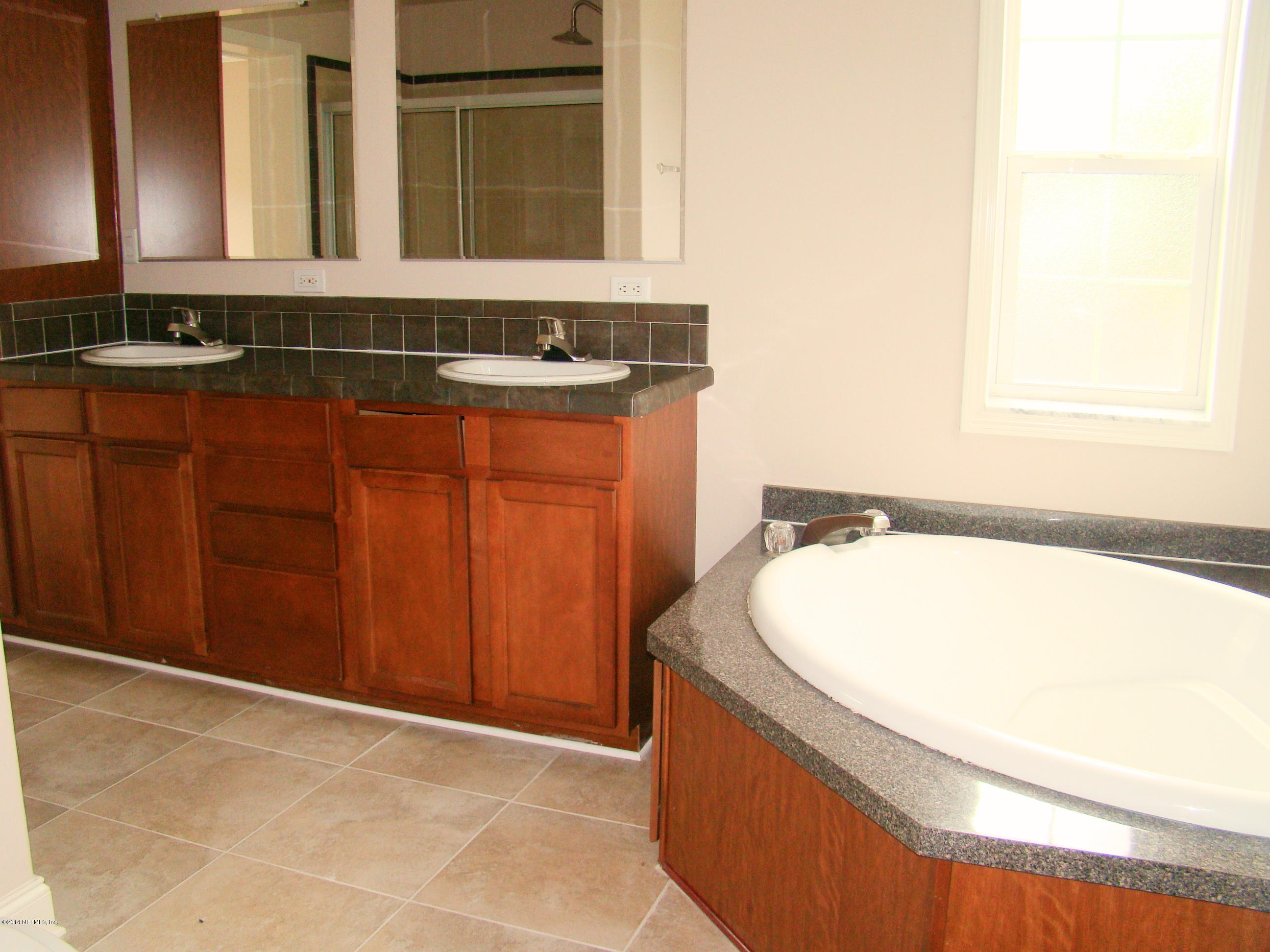 1716 Mccaul Road Jacksonville, FL 32220 - Photo 19 of 25 a bathroom with a bathtub and a sink