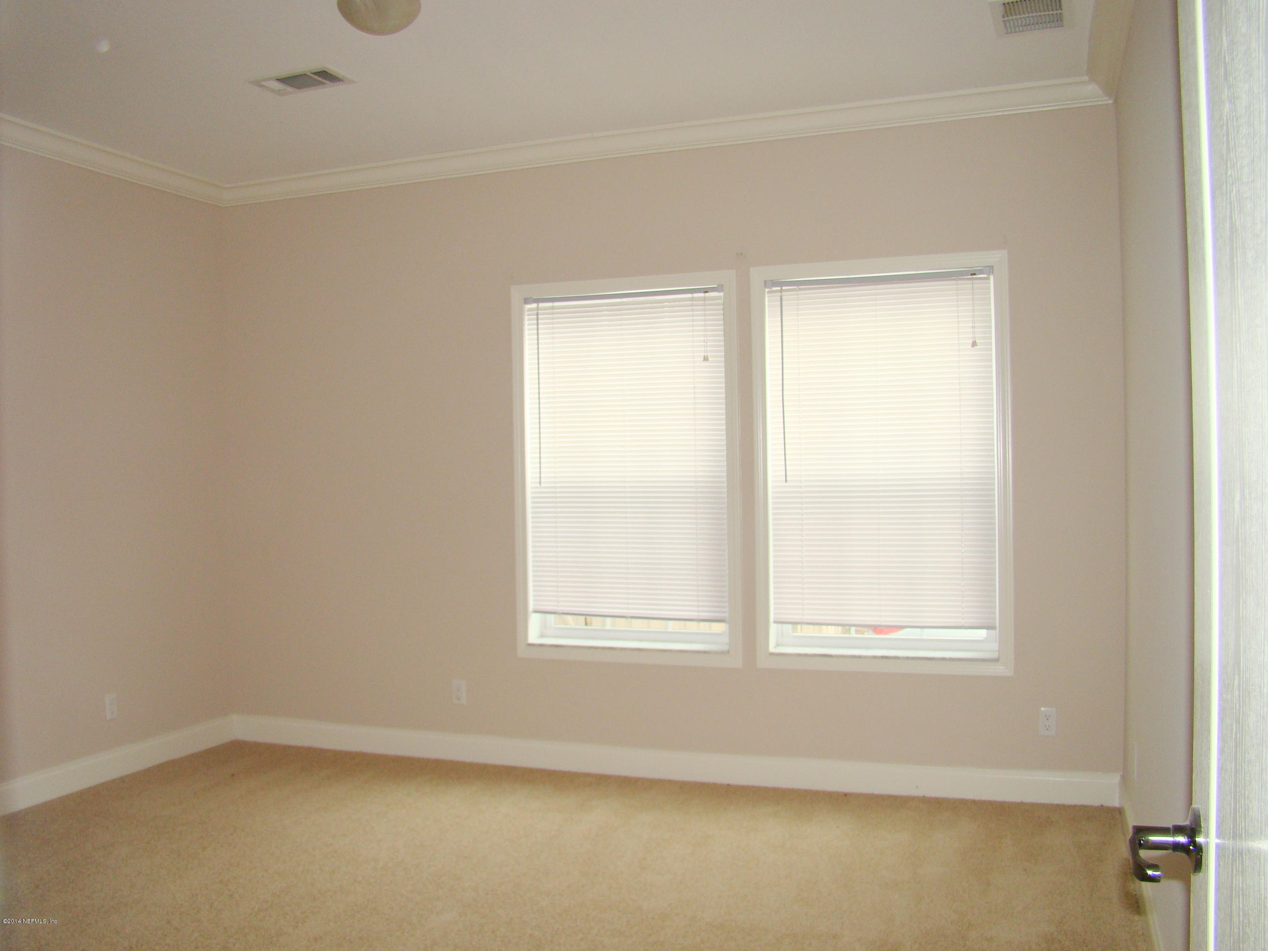 1716 Mccaul Road Jacksonville, FL 32220 - Photo 20 of 25 an empty room with a window