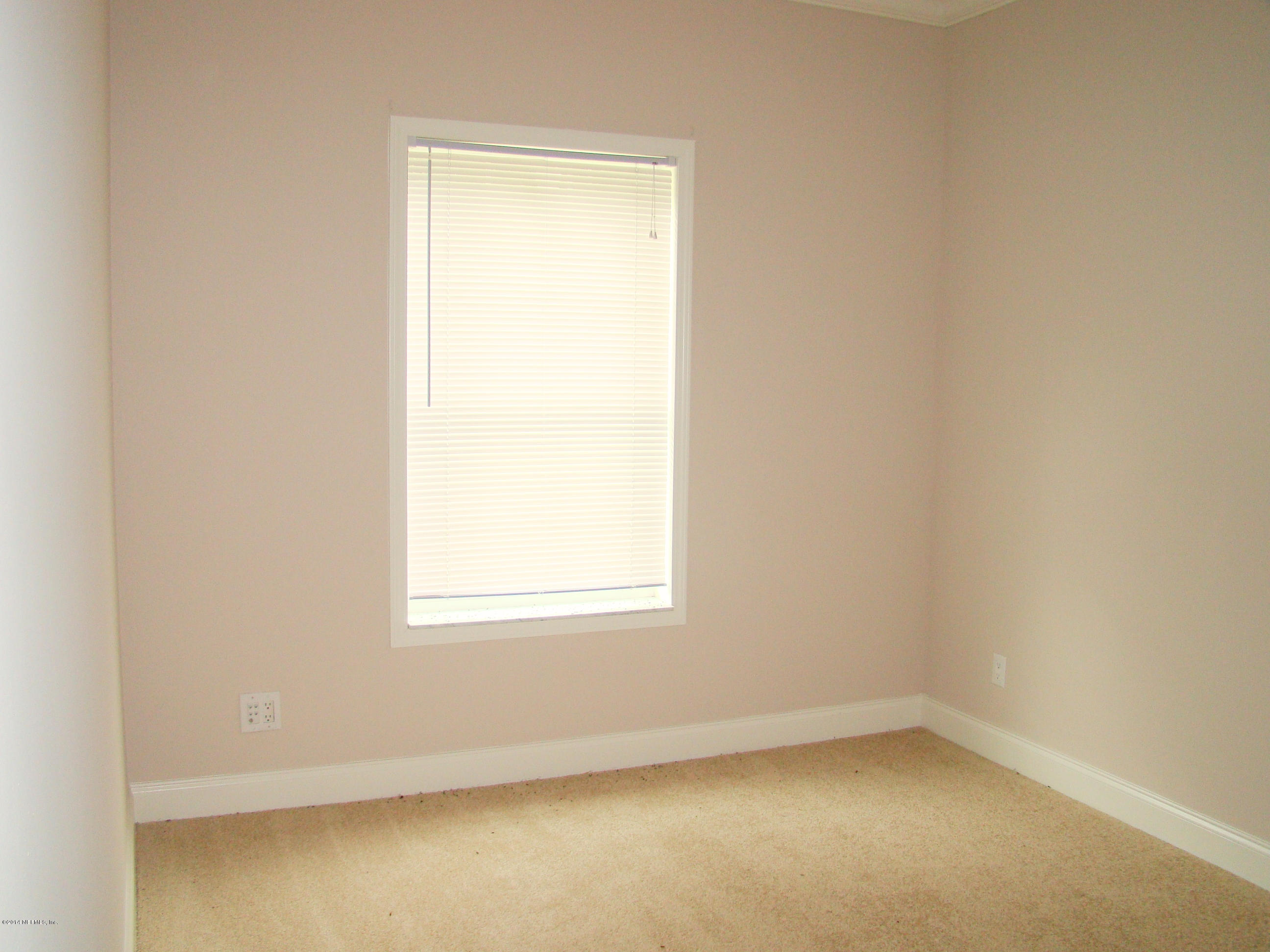 1716 Mccaul Road Jacksonville, FL 32220 - Photo 21 of 25 an empty room with a window