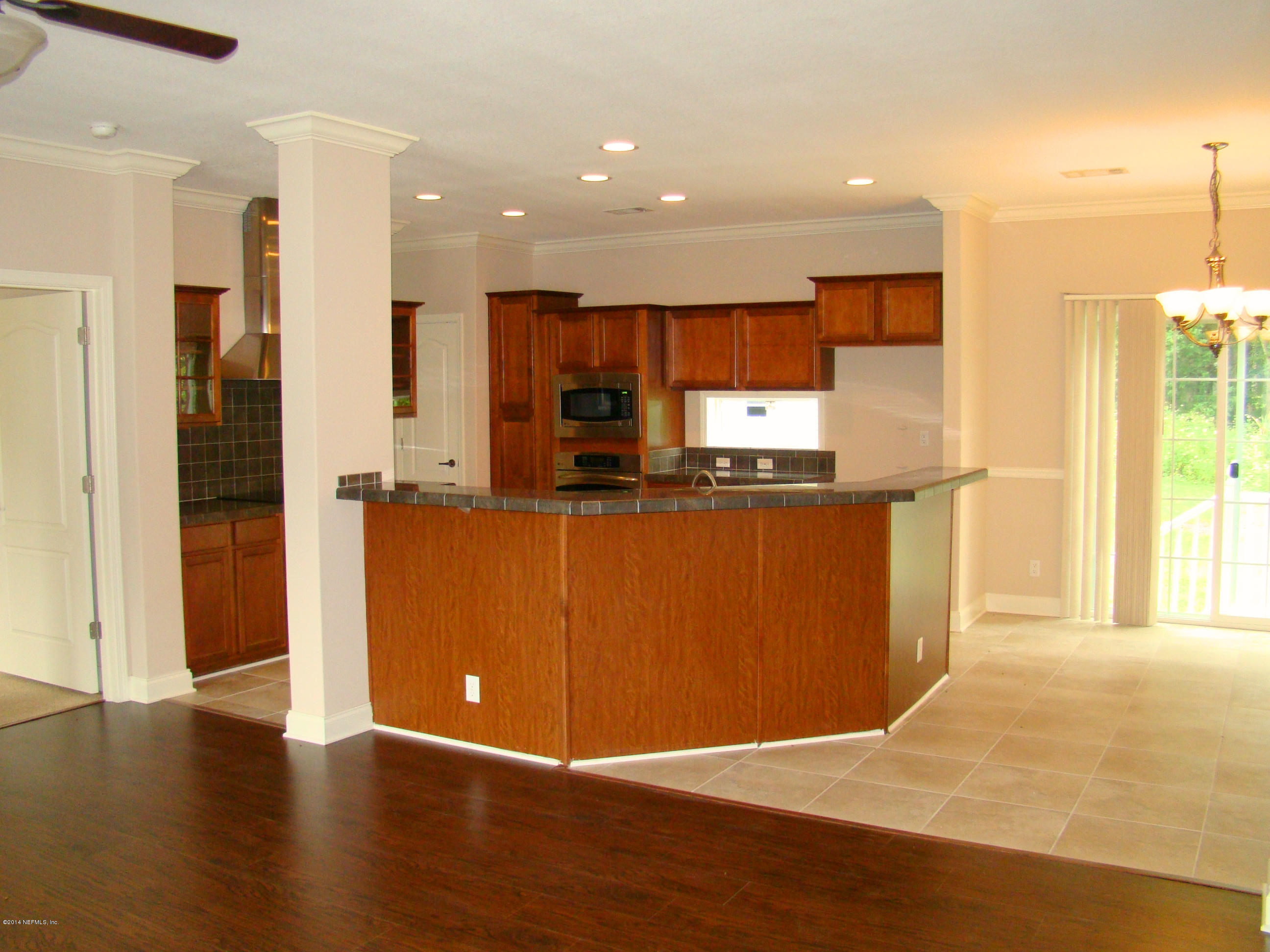 1716 Mccaul Road Jacksonville, FL 32220 - Photo 25 of 25 a kitchen with stainless steel appliances granite countertop a refrigerator and a sink