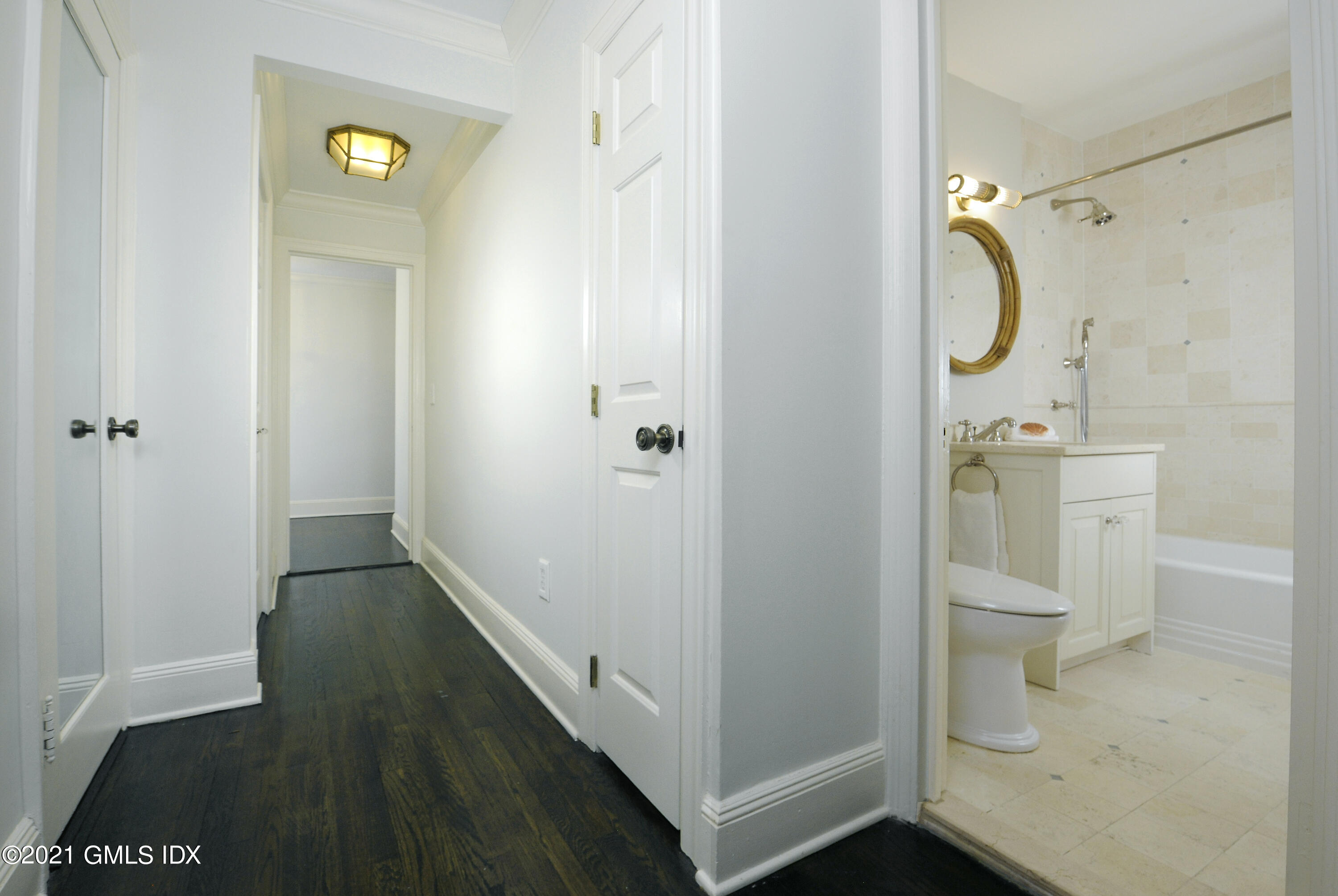 25 West Elm Street, Unit 47 Greenwich, CT 06830 - Photo 17 of 18 a bathroom with a glass door shower a toilet and a sink