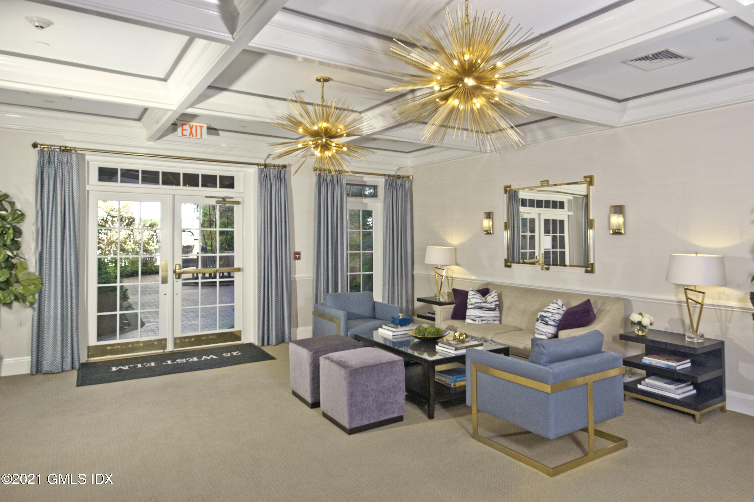 25 West Elm Street, Unit 47 Greenwich, CT 06830 - Photo 2 of 18 a living room with furniture and a chandelier
