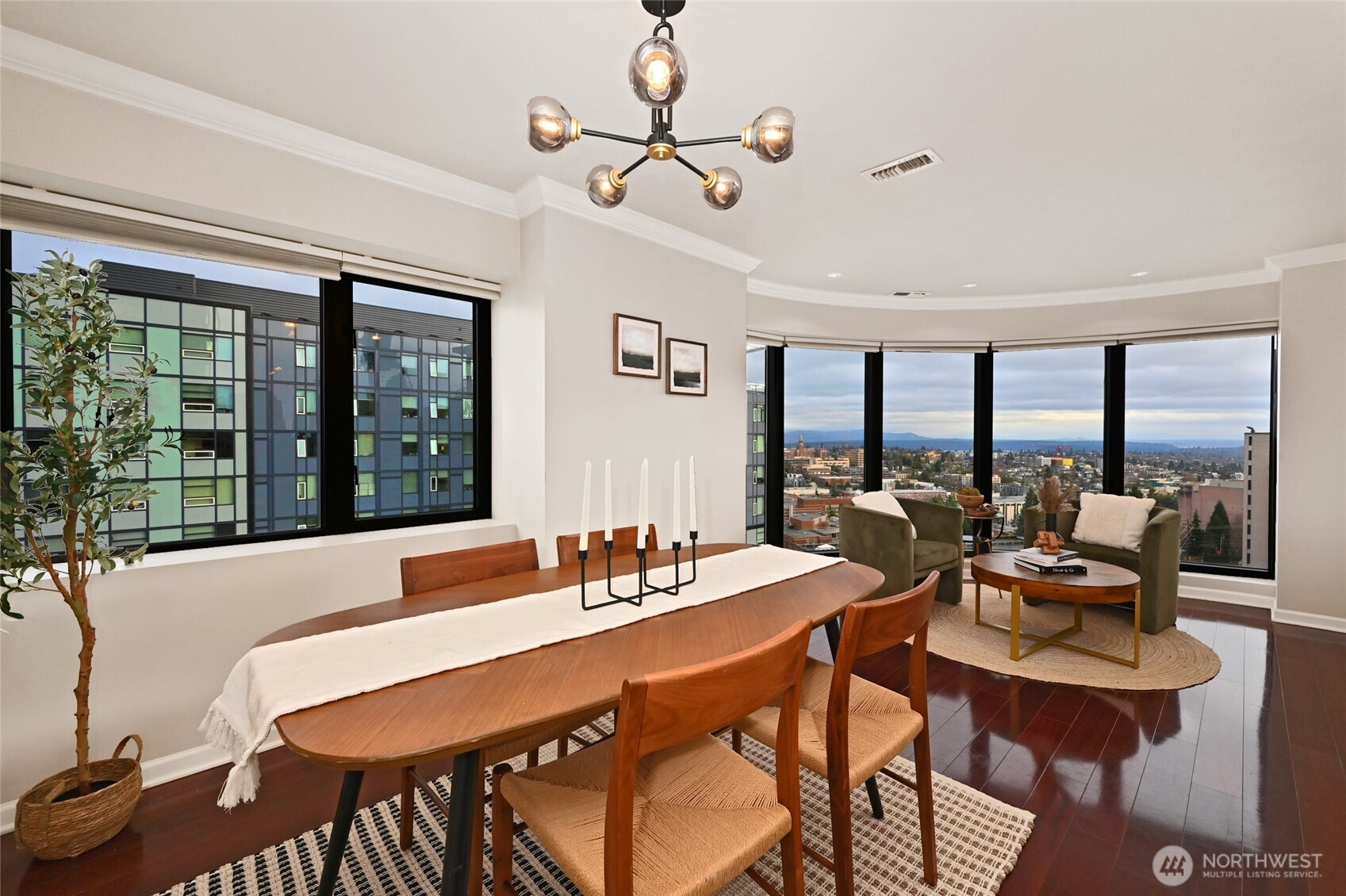 1301 Spring Street, Unit 16C Seattle, WA 98104 - Photo 6 of 33 a view of a dining room with furniture window and outside view