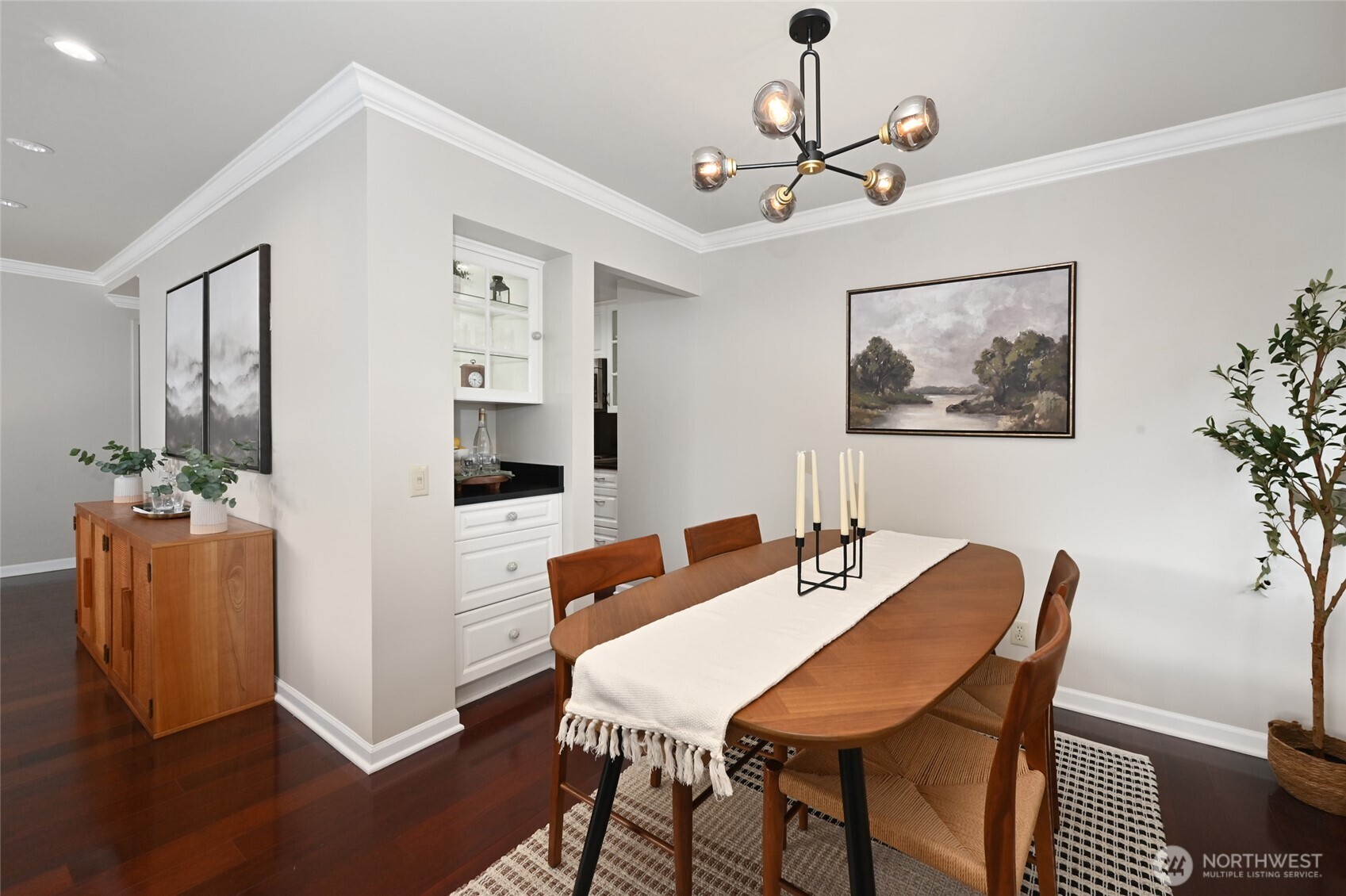 1301 Spring Street, Unit 16C Seattle, WA 98104 - Photo 8 of 33 a view of a dining room with furniture and wooden floor
