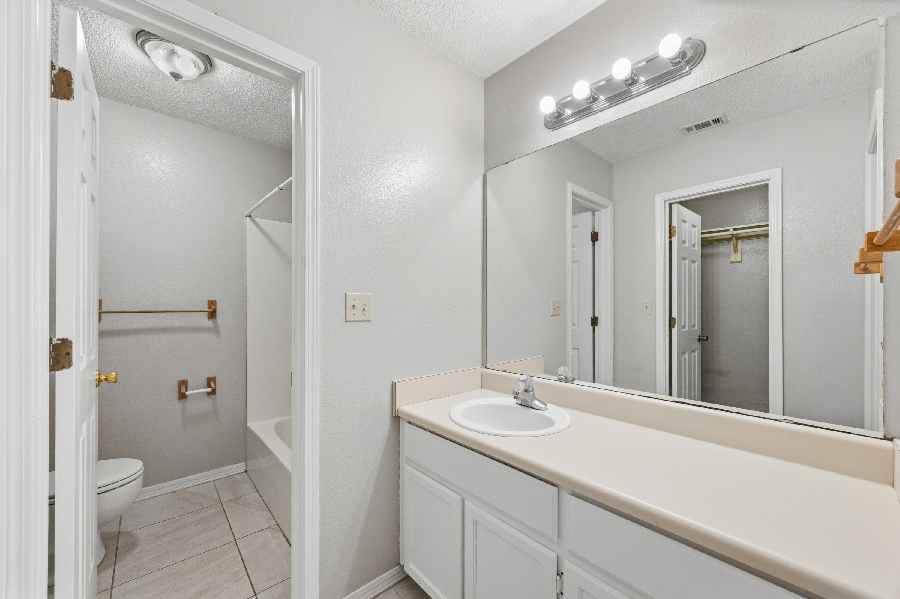 815 Valley Road Crestview, FL 32539 - Photo 20 of 40 a bathroom with a sink a toilet and shower