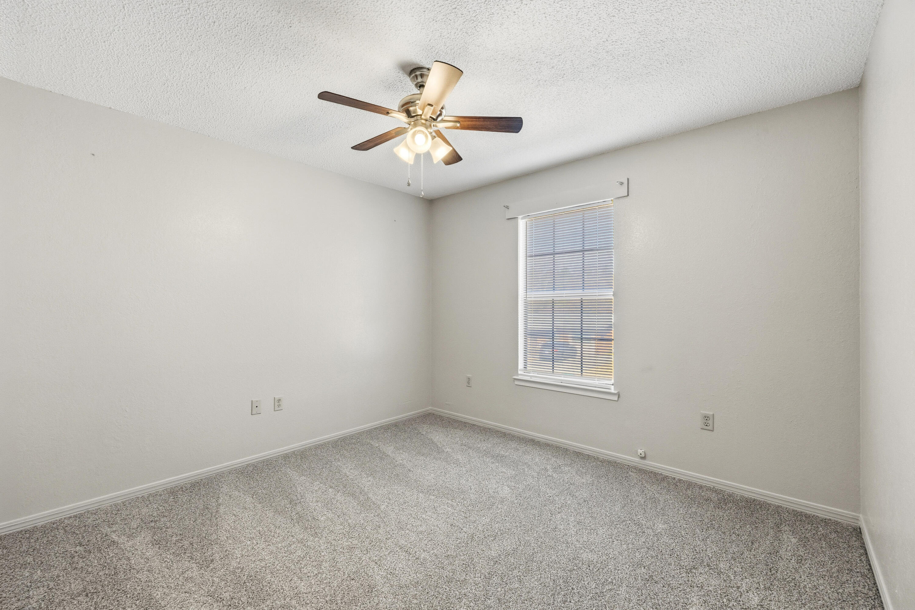 815 Valley Road Crestview, FL 32539 - Photo 23 of 40 an empty room with windows and fan