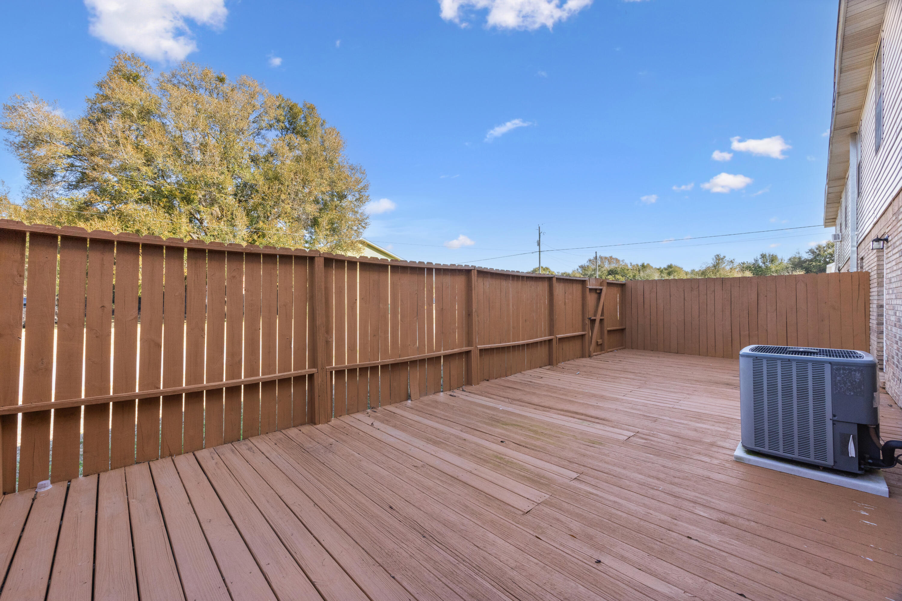 815 Valley Road Crestview, FL 32539 - Photo 34 of 40 a view of a wooden deck