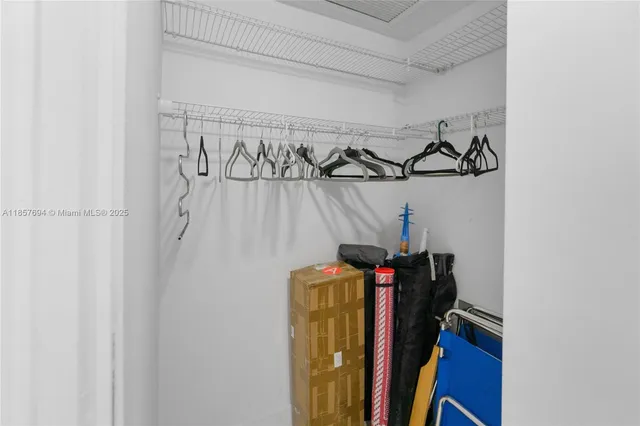 a view of a closet with storage