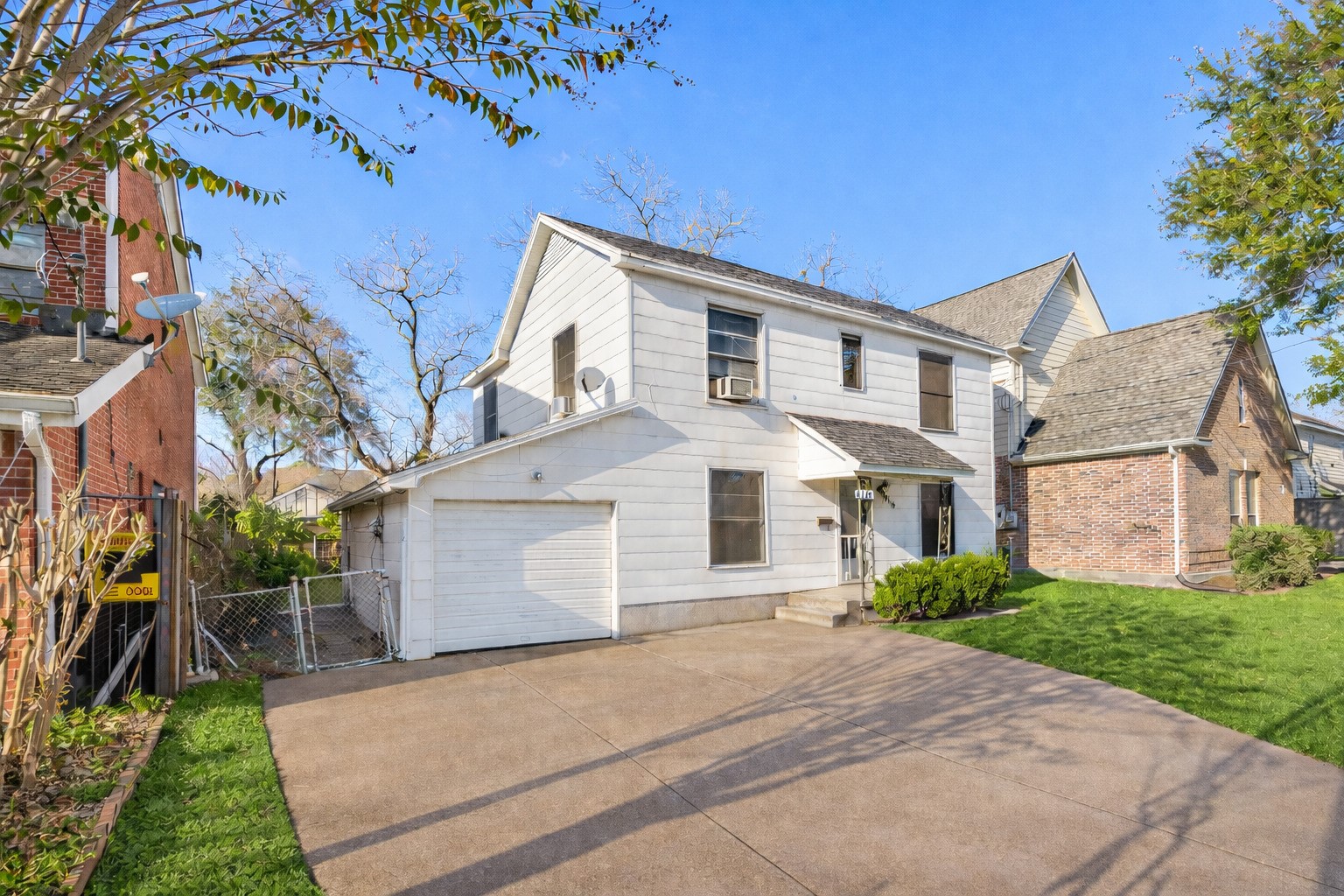4116 Bissonnet Street Houston, TX 77005 - Photo 5 of 20 Digitally enhanced clean exterior view featuring a private driveway and attached garage.